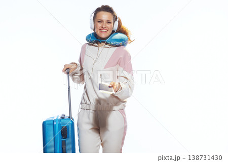 Happy Woman Traveler Holding Ticket and Suitcase Happy Woman Traveler Holding Ticket and Suitcase 138731430