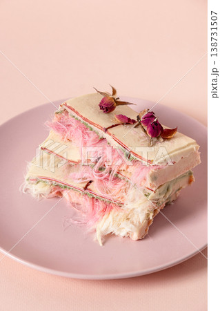 Artistic dessert with dried roses on pastel plate minimal food styling 138731507