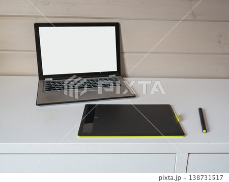 Laptop and graphic tablet workspace setup 138731517