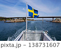 Swedish flag on ferry near bridge between Styrso and Donso islands of Gothenburg archipelago, Gothenburg Minucipality, Vastra Gotaland County, Sweden, sunny day 138731607