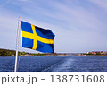 Swedish flag on ferry near bridge between Styrso and Donso islands of Gothenburg archipelago, Gothenburg Minucipality, Vastra Gotaland County, Sweden, sunny day 138731608