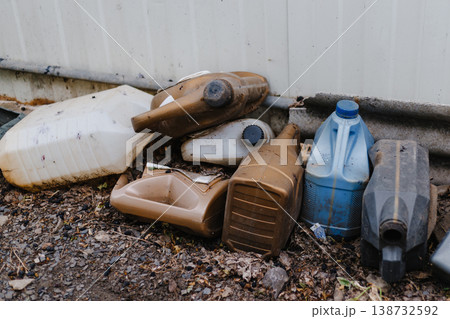 Dirty empty cans of car oil. Plastic. Environmental pollution Dirty empty cans of car oil. Plastic. Environmental pollution 138732592