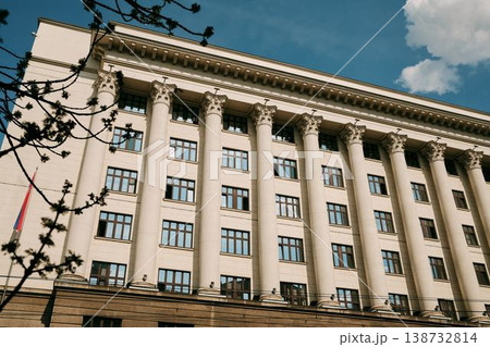 Large neoclassical government building with tall columns and Serbian flag in Belgrade. Concept of authority, stability and institutional architecture 138732814