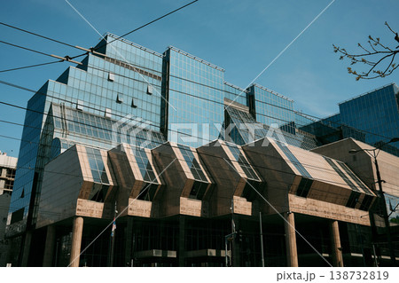 Contemporary glass office building with geometric facade in Belgrade. Concept of business, finance and modern urban development Contemporary glass office building with geometric facade in Belgrade. Concept of business, finance and modern urban development 138732819