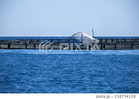 Offshore Fish Farm in the Open Sea. Sustainable Fish Farming in the Middle of the Sea. Offshore Fish Farm in the Open Sea. Sustainable Fish Farming in the Middle of the Sea. 138734139