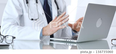 Doctor discussing medical information during an online consultation via teleconference, providing remote healthcare service. Medicine, healthcare and science concept Doctor discussing medical information during an online consultation via teleconference, providing remote healthcare service. Medicine, healthcare and science concept 138735060