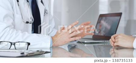 Doctor consulting patient about healthcare, discussing diagnosis, offering medical advice in clinic. Medicine, healthcare and science concept Doctor consulting patient about healthcare, discussing diagnosis, offering medical advice in clinic. Medicine, healthcare and science concept 138735133