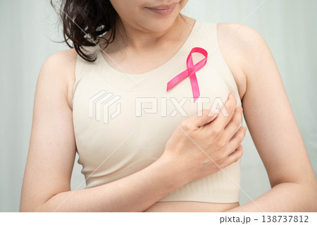 Asian woman with pink ribbon for October world breast cancer day. 138737812