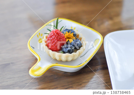 cheese tart , tart with strawberry and blueberry topping or strawberry tart or strawberry cheese tart cheese tart , tart with strawberry and blueberry topping or strawberry tart or strawberry cheese tart 138738465