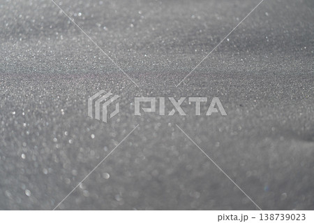 Icy reflective surface. Closeup of crystal clear ice with shimmering ridges and frost designs. Macro shot capturing intricate frost formations and luminous edges on icy surface Icy reflective surface. Closeup of crystal clear ice with shimmering ridges and frost designs. Macro shot capturing intricate frost formations and luminous edges on icy surface 138739023