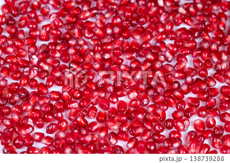 Vivid red mosaic. Red arils arranged in glossy mosaic pattern representing health. Colorful pomegranate seeds form shiny mosaic ideal for wellness branding and advertising 138739288