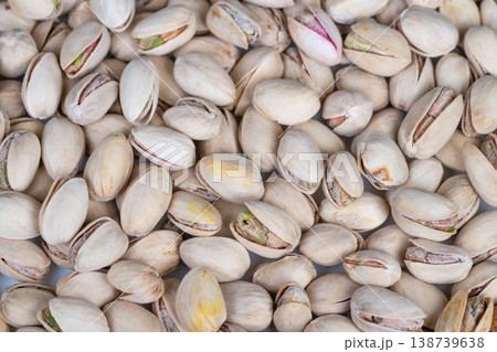 Shelled pistachios demonstrated as versatile ingredient for chefs. Pistachios displayed densely to highlight their flexible use in baking and cooking procedures Shelled pistachios demonstrated as versatile ingredient for chefs. Pistachios displayed densely to highlight their flexible use in baking and cooking procedures 138739638