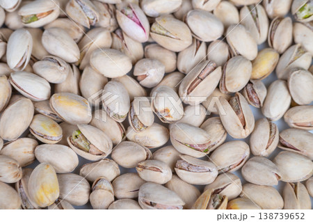 Closeup of healthy pistachios emphasizing nourishment. Detailed view of pistachios emphasizing wholesome quality and vital nutritional benefits for wellness branding 138739652