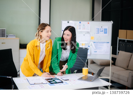 Woman people meeting team brainstorming on their project with laptop, smartphone and digital tablet. Woman people meeting team brainstorming on their project with laptop, smartphone and digital tablet. 138739726