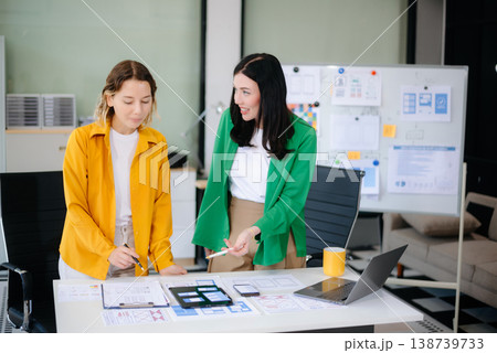 Woman people meeting team brainstorming on their project with laptop, smartphone and digital tablet. Woman people meeting team brainstorming on their project with laptop, smartphone and digital tablet. 138739733