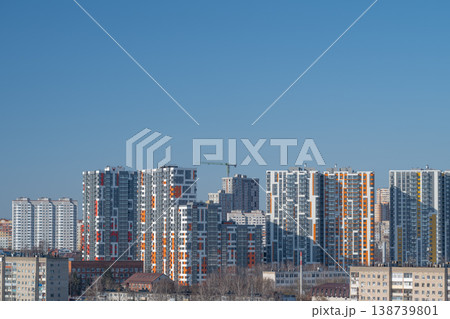 Modern urban skyline changing shapes. An urban horizon depicting diverse building heights coupled with shifting light reflections and seasonal atmospheric influences 138739801