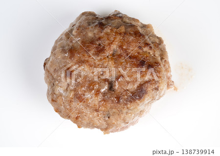 Single browned meat cutlet photographed closeup on white background, crisp sear and granular texture visible, isolated studio lighting ideal for ecommerce and catalog use 138739914
