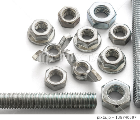 construction bolts and nuts on a white isolated background construction bolts and nuts on a white isolated background 138740597