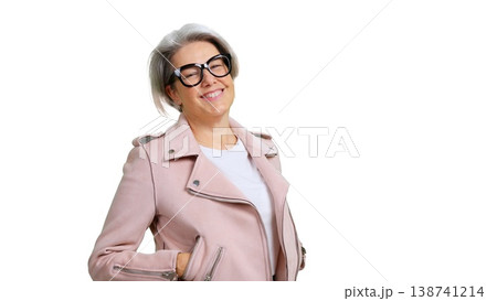 Confident mature woman smiling wearing pink jacket and eyeglasses 138741214