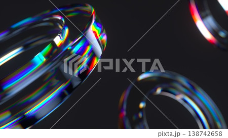 Abstract 3D glass torus or tube with chromatic dispersion and defocused bokeh effect. 3d render iridescent refraction on dark background for modern tech and luxury designs. Abstract 3D glass torus or tube with chromatic dispersion and defocused bokeh effect. 3d render iridescent refraction on dark background for modern tech and luxury designs. 138742658