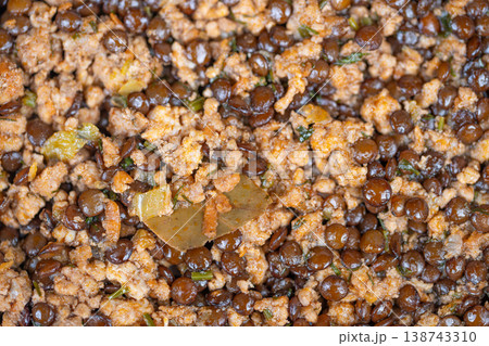 Proteinrich lentil mixture. Nourishing lentils combined with minced meat and seasonings. Flavorful and nutritious lentil and minced meat blend ideal for healthy meal preparation 138743310