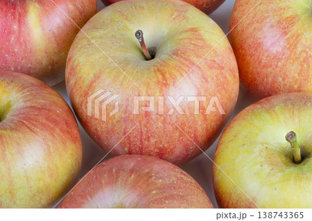 Vibrant fruit illustrating health. Juicy green and red apples emphasizing nutrition. Brightly colored apples emphasizing natural wellness benefits and nourishing qualities 138743365