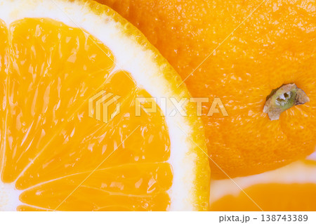 Juicy orange segment revitalizes post workout refreshment. Juicy sliced orange alongside water bottle provides essential hydration and natural energy boost for athletes 138743389