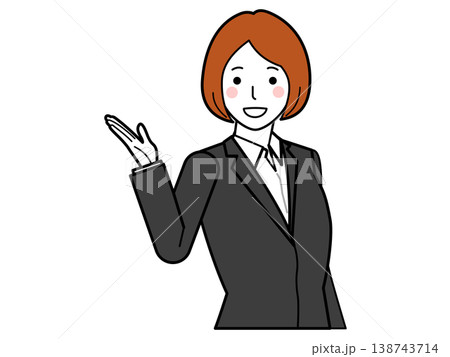 こちらと手で指し示しながら説明するグレースーツの女性 こちらと手で指し示しながら説明するグレースーツの女性 138743714