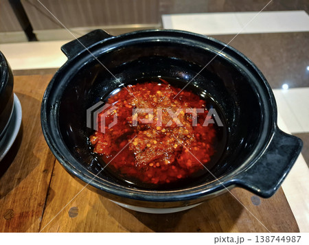 Red Chili Sauce in Black Bowl on Wooden Table 138744987