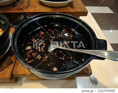 Spicy black chili sauce pot at a buffet 138744989