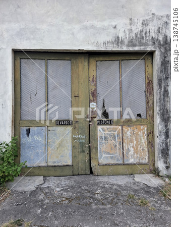 Vintage Moody Image of Old Distressed Wooden Garage Doors 138745106