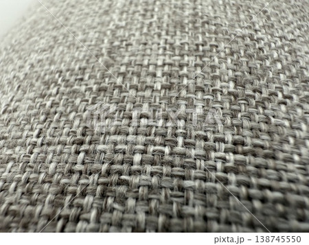 Textured fabric closeup showing woven pattern and fibers, suitable for backgrounds and materials Textured fabric closeup showing woven pattern and fibers, suitable for backgrounds and materials 138745550
