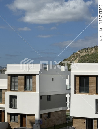 Modern white building against blue sky and cloud background 138745560