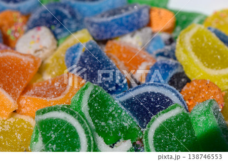 Colorful gummy candies arranged on a white surface create a visually delightful treat tempting every sweet tooth in the room Colorful gummy candies arranged on a white surface create a visually delightful treat tempting every sweet tooth in the room 138746553