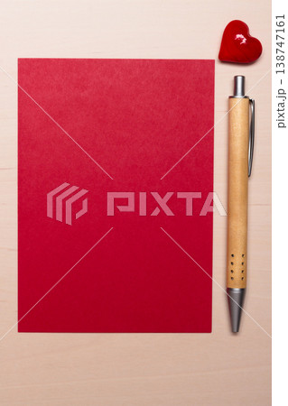 blank sheet of paper heart and pen on table 138747161