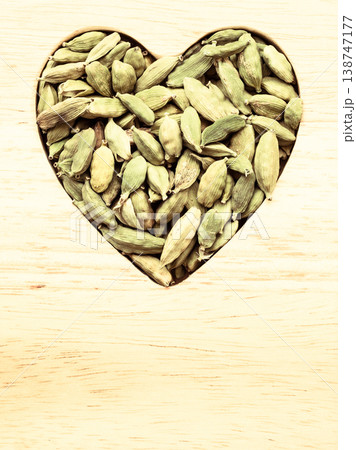 Green cardamom pods heart form Green cardamom pods heart form 138747177