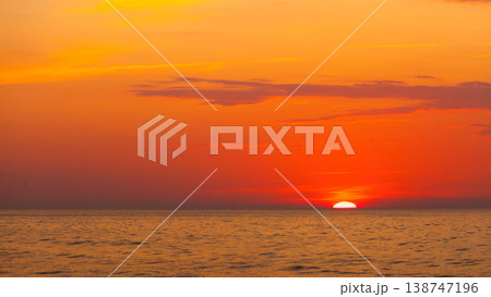 Idyllic shot of sunset by the sea Idyllic shot of sunset by the sea 138747196
