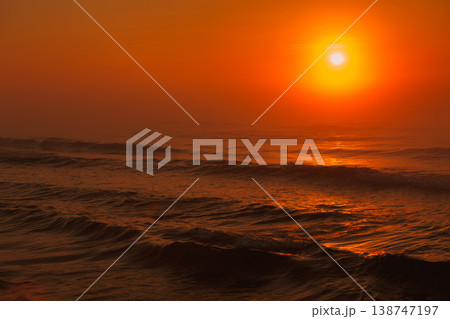 Beatiful red sunset over sea surface Beatiful red sunset over sea surface 138747197