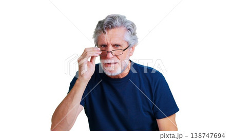 Senior man squinting with glasses showing skepticism Senior man squinting with glasses showing skepticism 138747694
