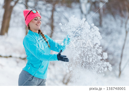 Girl relaxing in winter park. 138748001