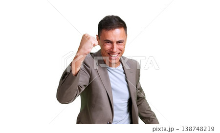 Happy man celebrating success with a fist pump 138748219