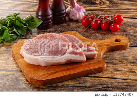 Raw pork steak over board 138748407