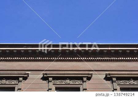 Ornate Brown Building Facade under Blue Sky Ornate Brown Building Facade under Blue Sky 138749214
