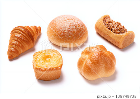 白背景にクロワッサンやクリームパンなど人気の菓子パンがバランスよく並んだ多様なパンの集合背景素材 138749738