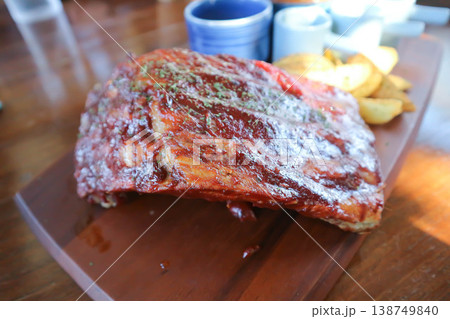 pork rib or pork steak , barbecue pork rib with french fries pork rib or pork steak , barbecue pork rib with french fries 138749840