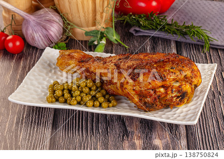 Baked turkey drumstick served green peas 138750824
