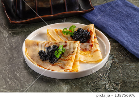 luxury pancake with black caviar 138750976