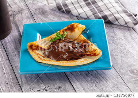 Sweet pancake with chocolate paste Sweet pancake with chocolate paste 138750977