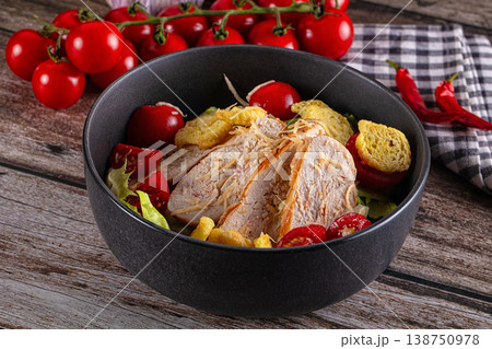 Salad caesar with chicken and croutons 138750978