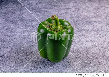 Fresh green bell peppers on a rustic table 138751019